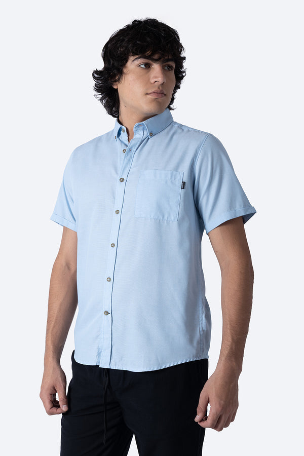 Camisa azul claro manga corta con bolsa - Hang Ten