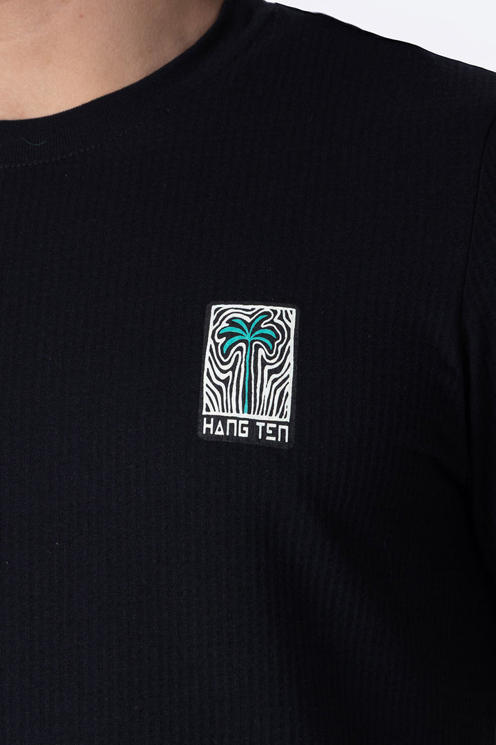 Playera negra con textura cuello redondo   - Hang Ten 