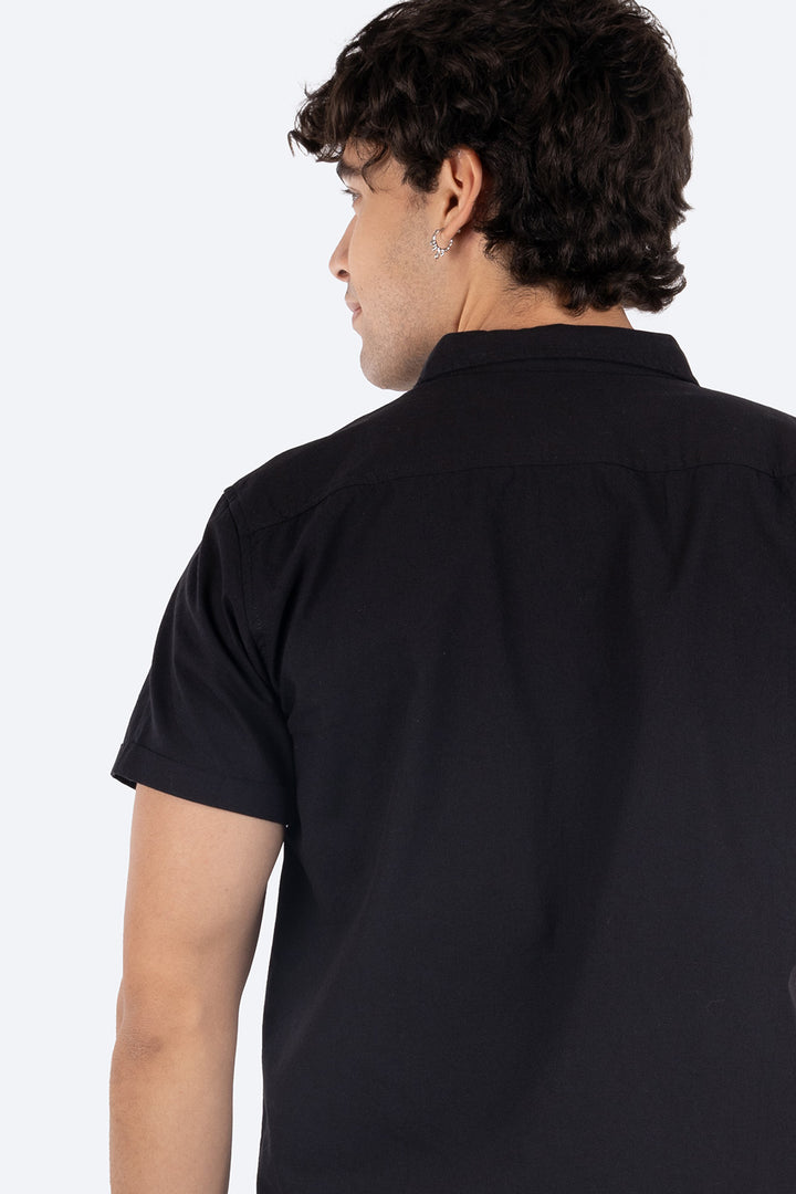 Camisa negra con bolsillo -Hang Ten