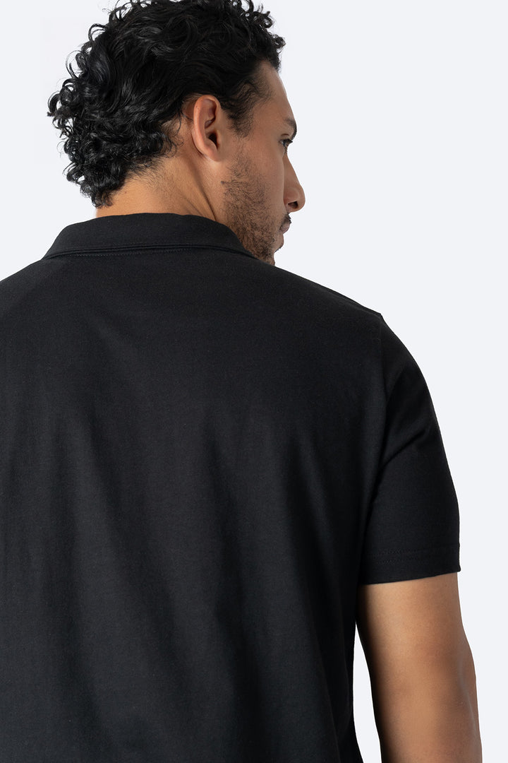 Polo básica negra con bolsa - Hang Ten
