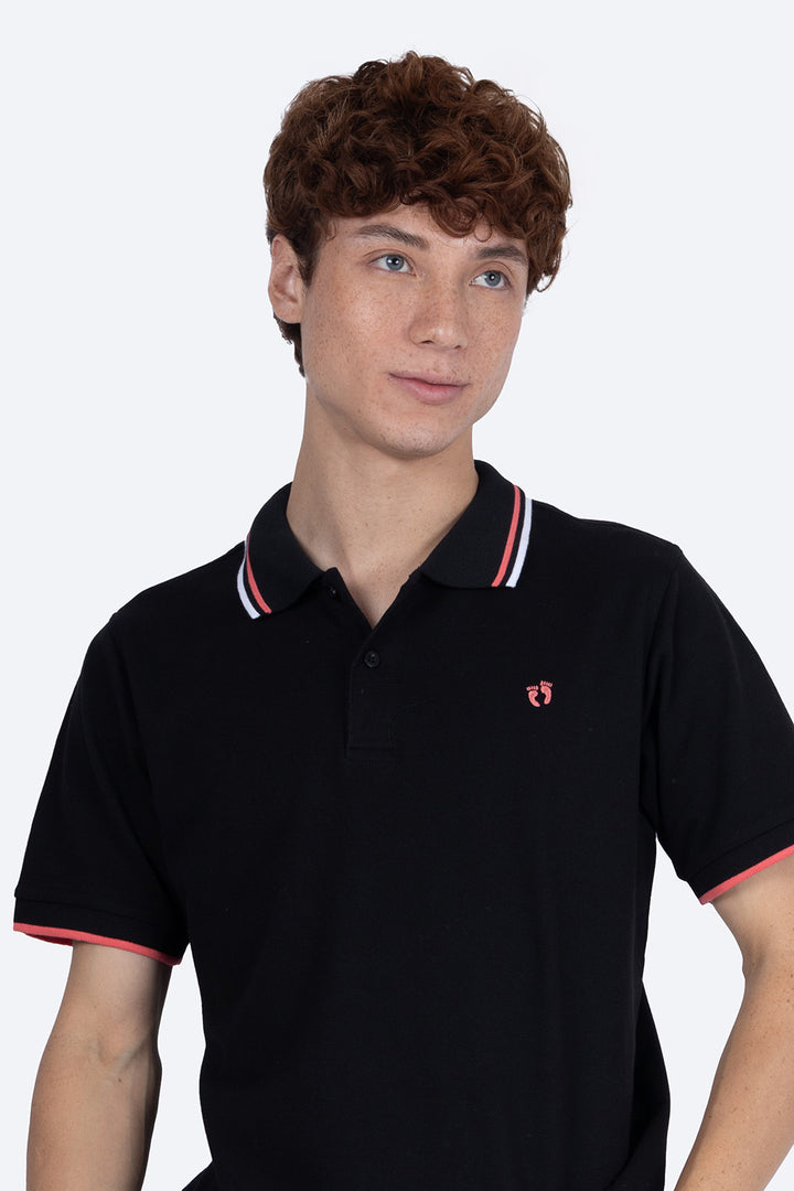 Polo piqué negra filos contraste blanco con rosa - Hang Ten 